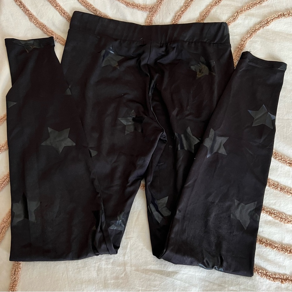 Ardene NWOT black leggings with metallic black stars